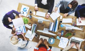 aerial table top photo with business colleagues in a working meeting